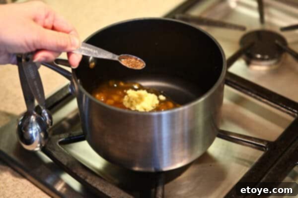 adding sugar to pot of glaze