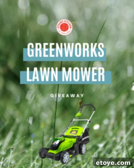 Greenworks 40V 17-inch Cordless Lawn Mower poised on a vibrant green lawn, ready for use
