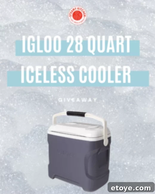 Igloo 28 Quart Iceless Thermoelectric Cooler plugged into a car, showcasing its sleek design and portability.
