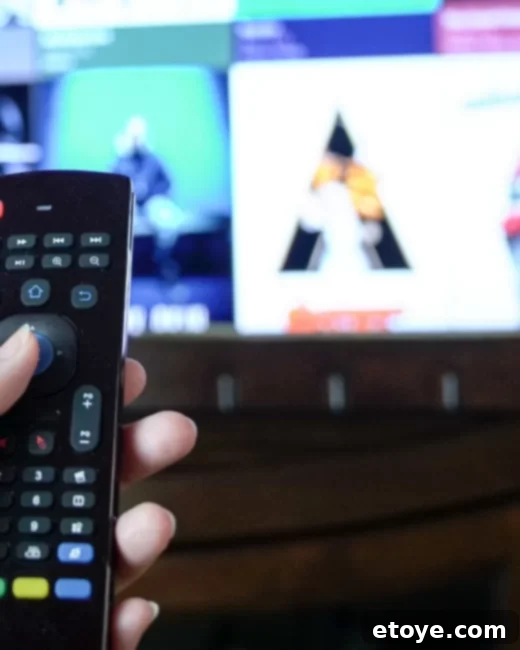 Enter to Win a $100 Walmart Shopping Spree 4 Person relaxing on a couch, watching TV with a remote control, representing home entertainment