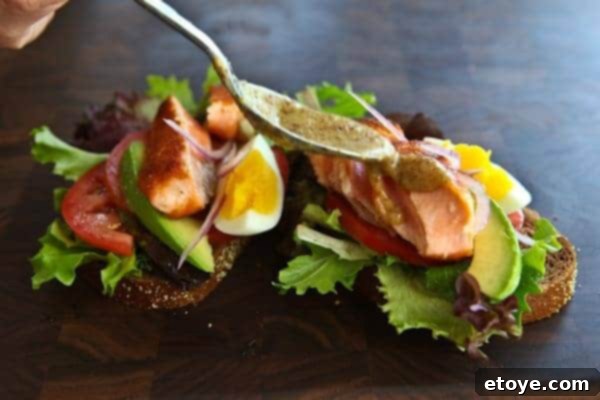 Sweet Mustard Sauce for Salmon Sandwich Sweet mustard sauce in a small white bowl, ready to be drizzled over the salmon sandwich.