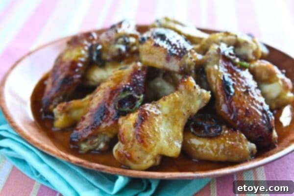 Signature Cola Wings 8 A platter of finished cola glazed chicken wings, ready to be served