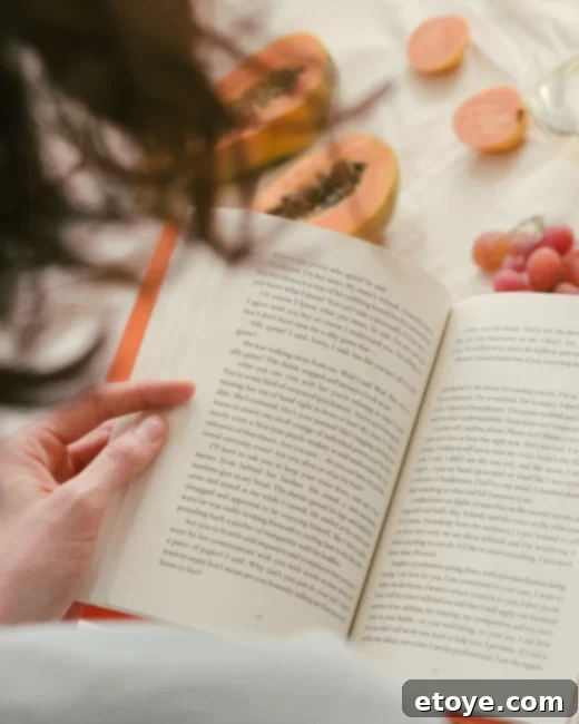 Person writing in a journal, focusing on their goals and plans