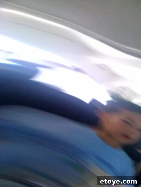 Keep Beaches Clean Forever 5 A pensive individual looking out from the rotating restaurant, a slight worry visible on their face