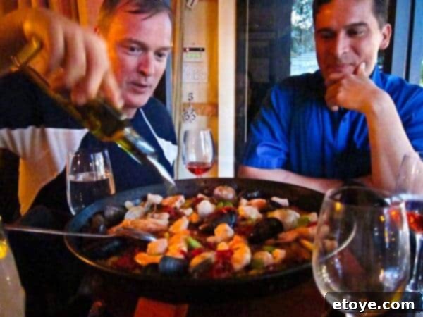 The Master Plan 14 Jacques Torres pouring olive oil over a dish of paella